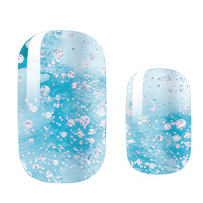 Blue glitter nail wraps with white pearl shimmer effects for winter manicure designs