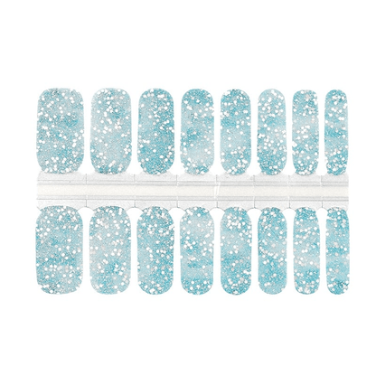 Blue glitter nail wrap sheet with sparkly winter pattern for at-home manicure