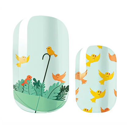 Individual nail wrap designs featuring mint green base with orange yellow birds and umbrella motifs