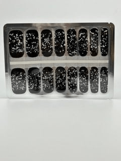 Black nail wraps with silver glitter constellation pattern in packaging sheet