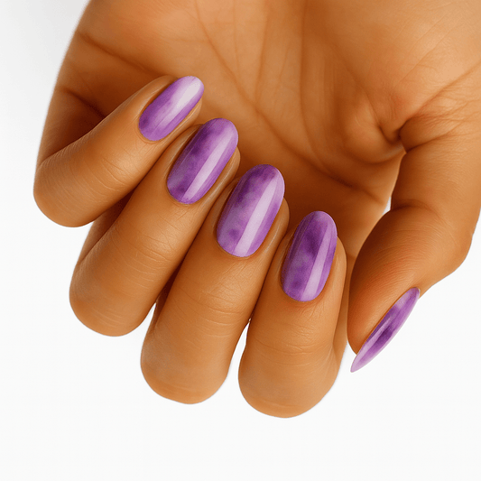 Purple marbled nail wraps with cloudy watercolour-effect pattern on oval nails