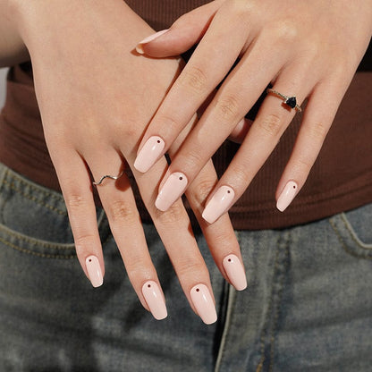 Pink polka dot nail art wraps displayed on both hands classic design