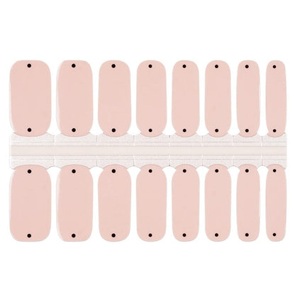Nude pink nail wraps with black polka dots in classic minimalist design sheet