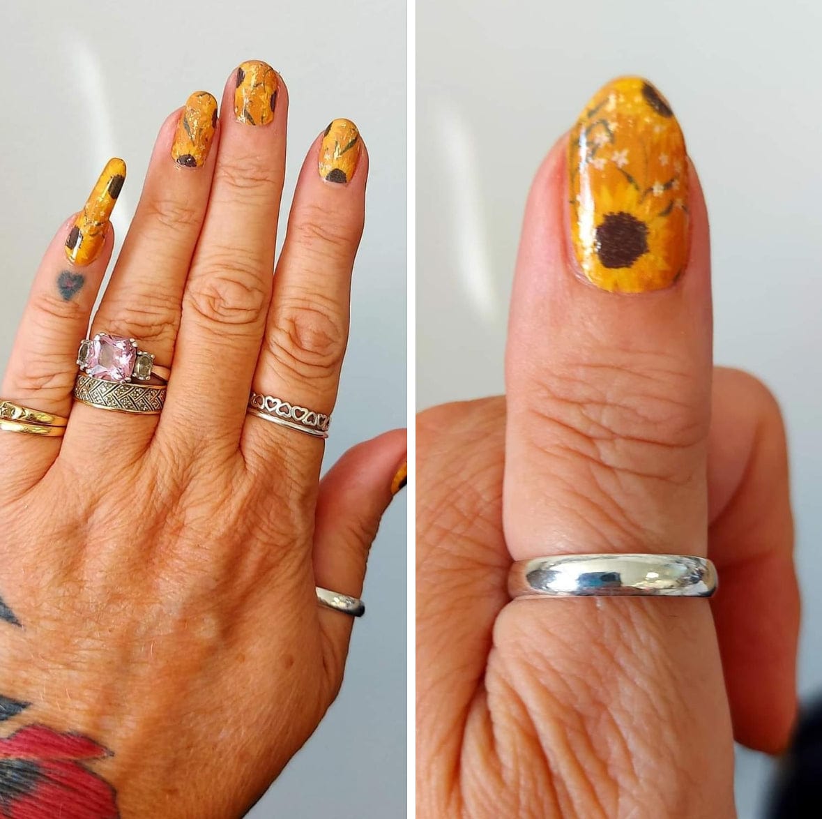 Orange yellow sunflower nail wraps on hand showing floral botanical design at-home manicure