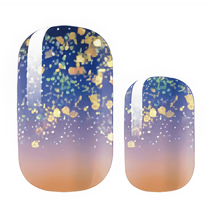 Navy-to-peach ombré nail wraps with gold glitter flecks and a white side stripe