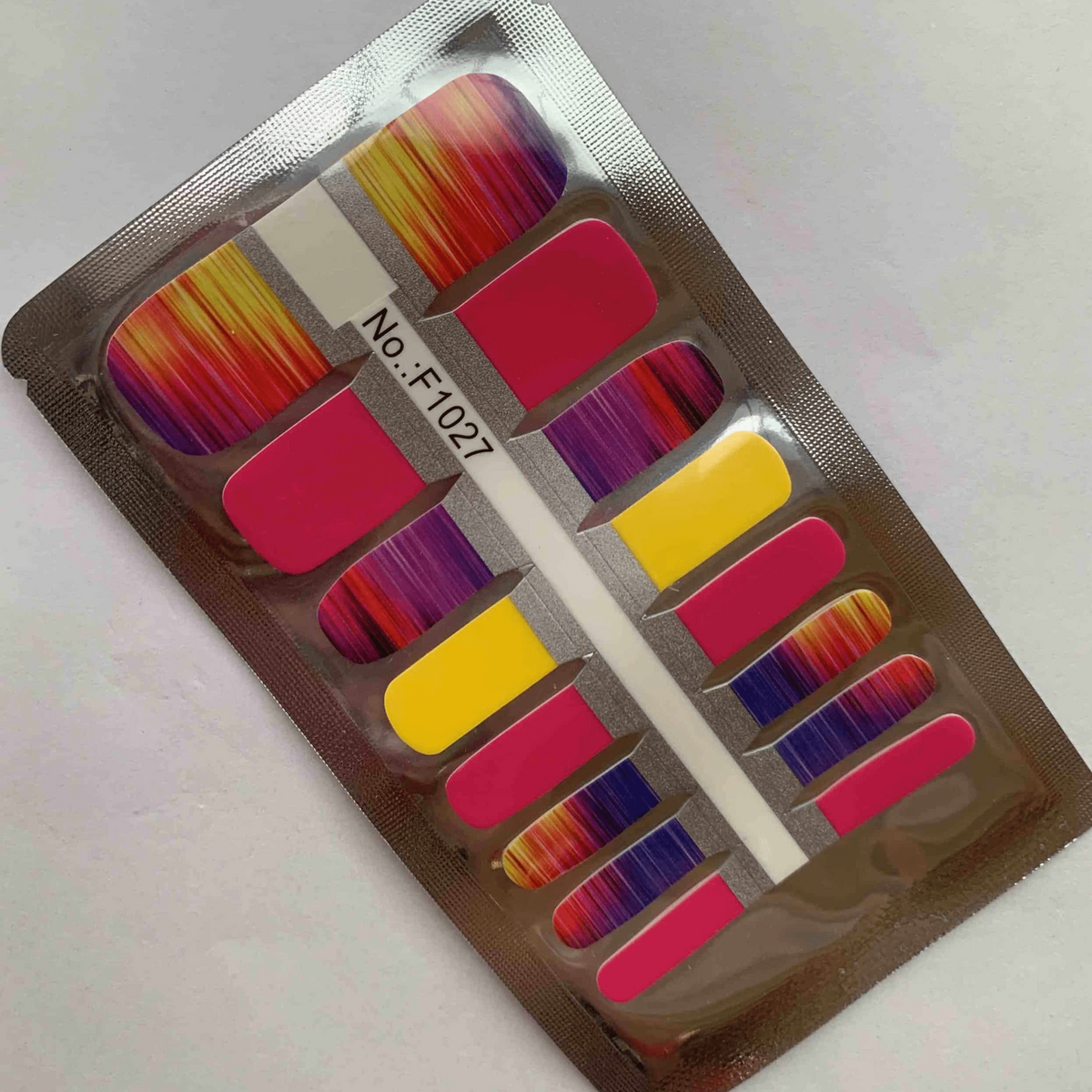 Non-UV nail wrap packaging with sunset gradient pedicure wraps and application tool