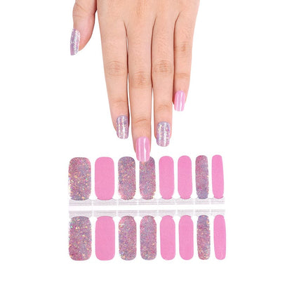Hand wearing pink nail wraps with holographic glitter and solid pink manicure