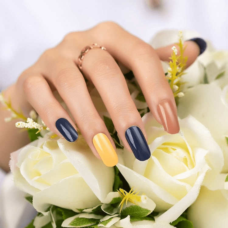 Glossy nail wraps in navy, mustard yellow and terracotta colour-block design