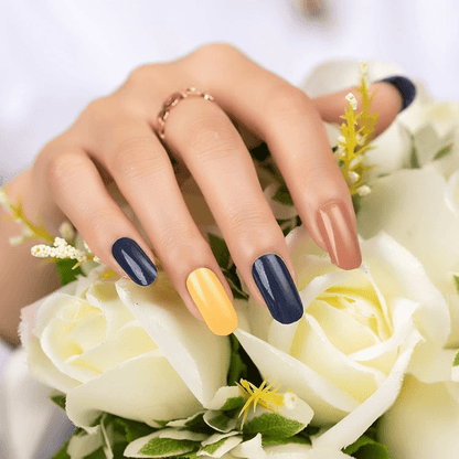 Glossy nail wraps in navy, mustard yellow and terracotta colour-block design