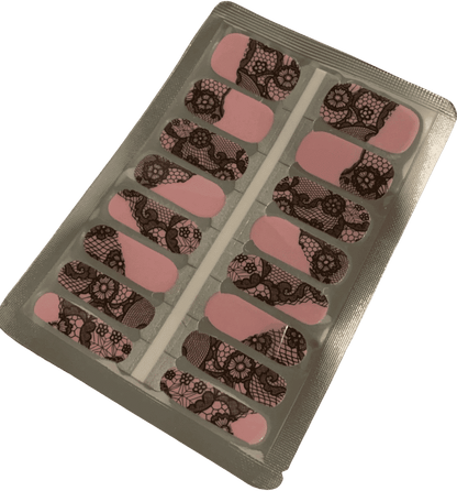 Non-UV nail wraps sheet featuring black lace pattern on pink base for manicure
