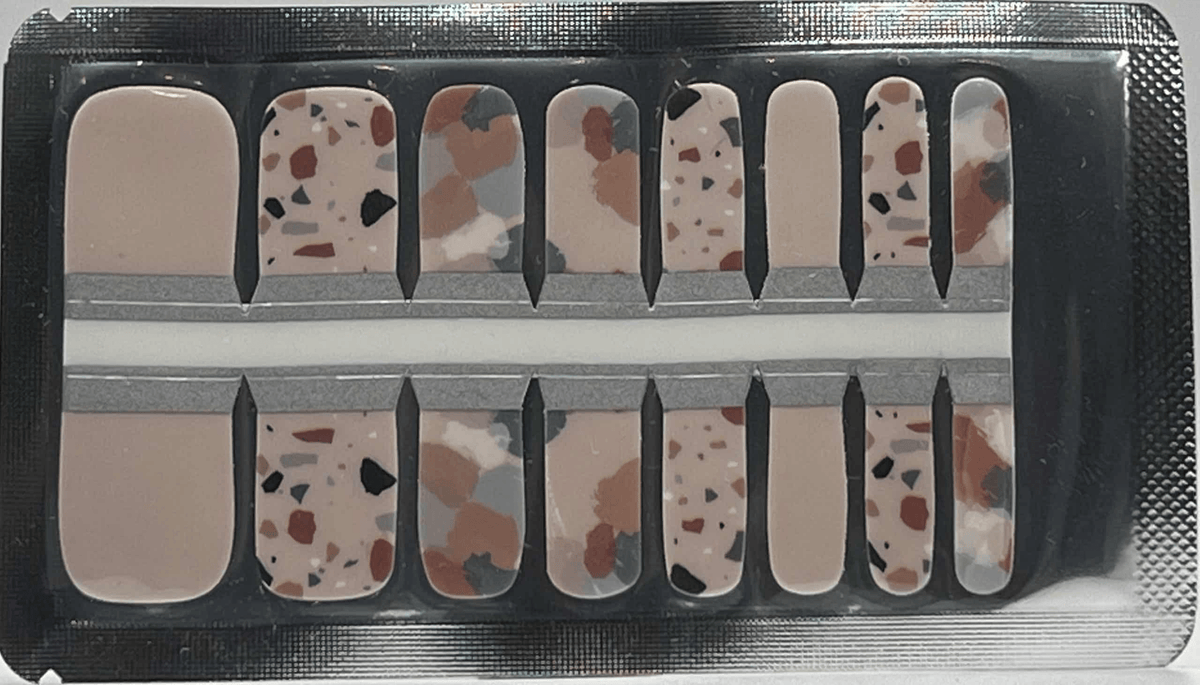 Terrazzo pedicure nail wraps sheet showing speckled stone pattern in neutral earth tones