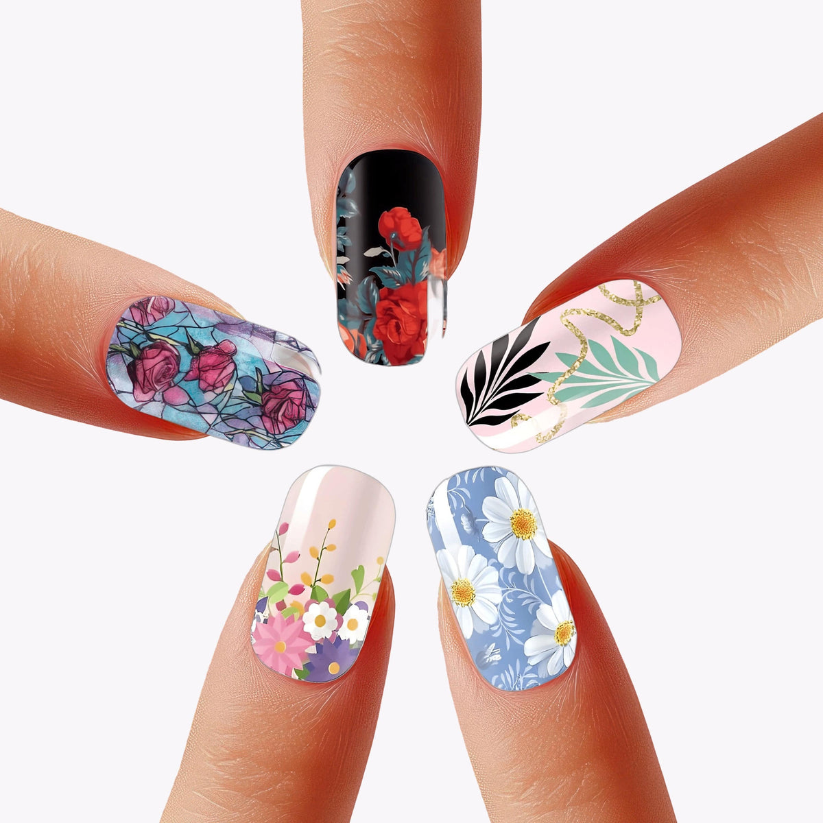 Floral nail wraps on fingertips showing botanical patterns and colourful flower designs