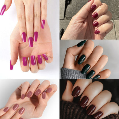 At-home manicure results showing glossy burgundy, purple, green and pink nail wraps on hands