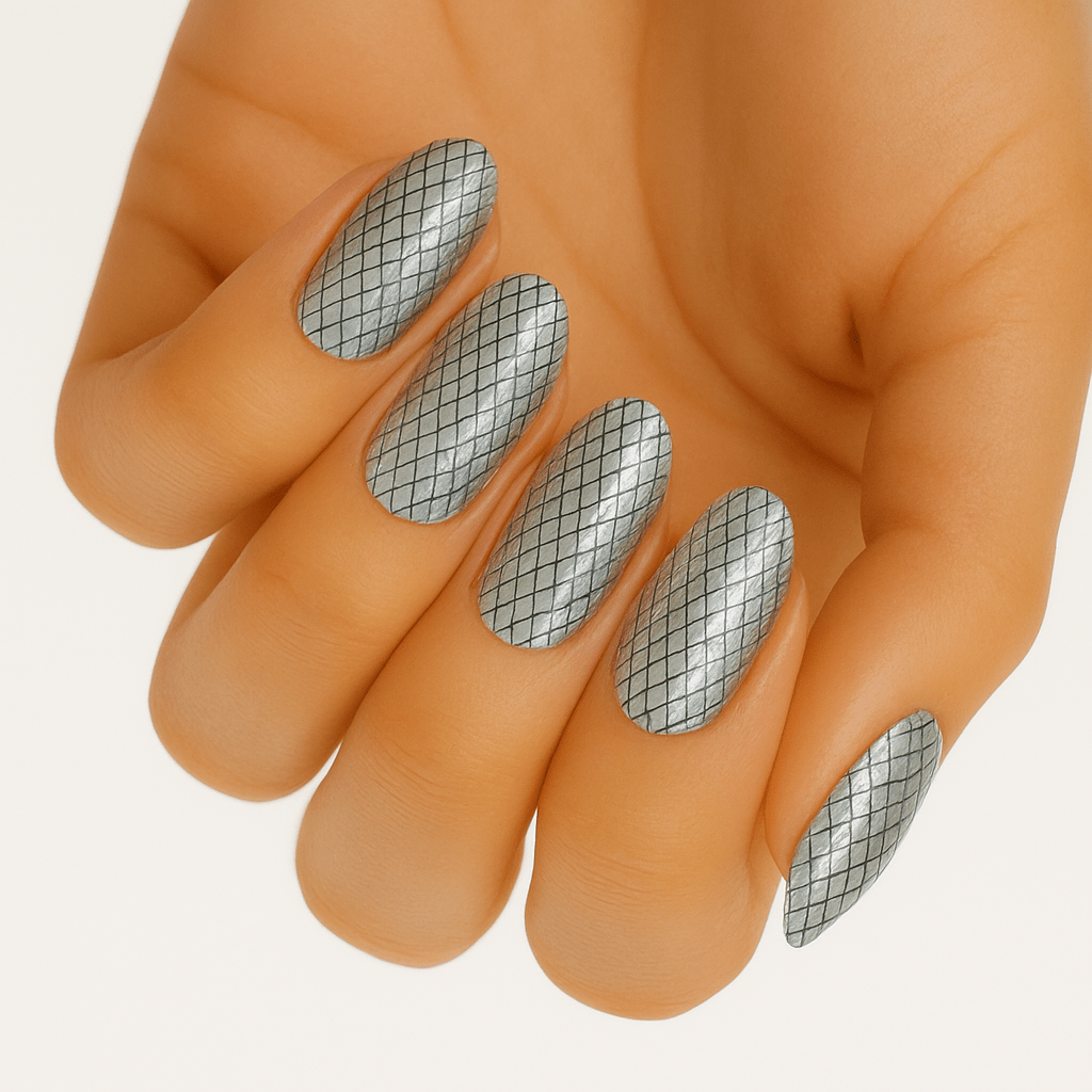 Holographic silver grid pattern nail wraps on hand showing geometric diamond design