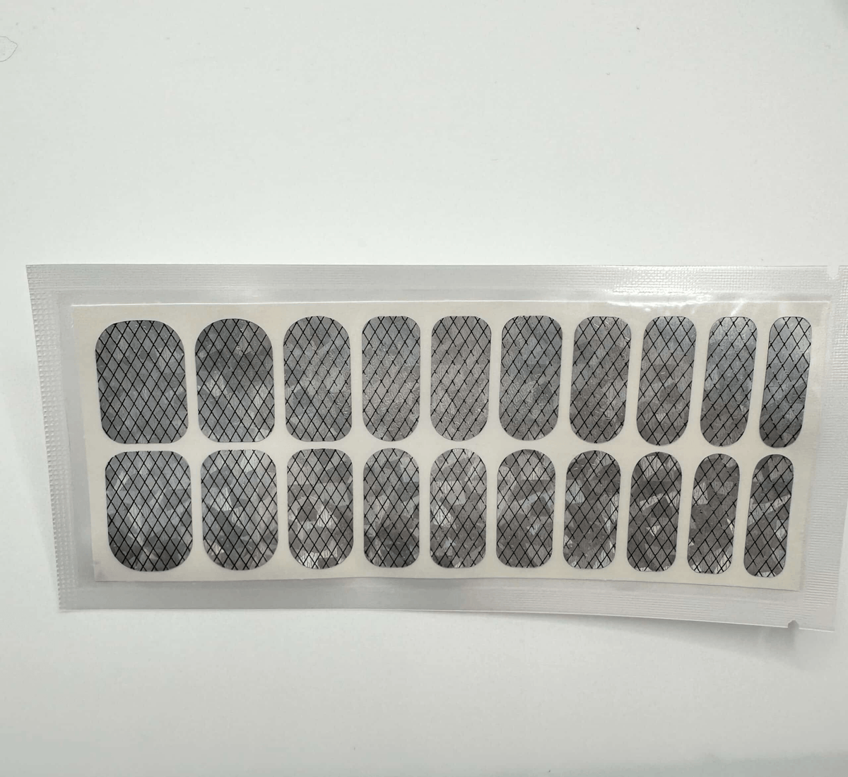 Silver holographic geometric grid nail wraps sheet showing 20 piece wide fit sizes