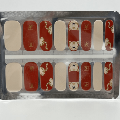 Tiger character nail wraps sheet showing red and white animal themed nail art designs