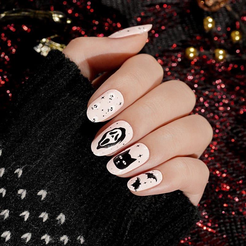 Halloween nail art featuring spooky ghost and cat designs on non-UV nail wraps