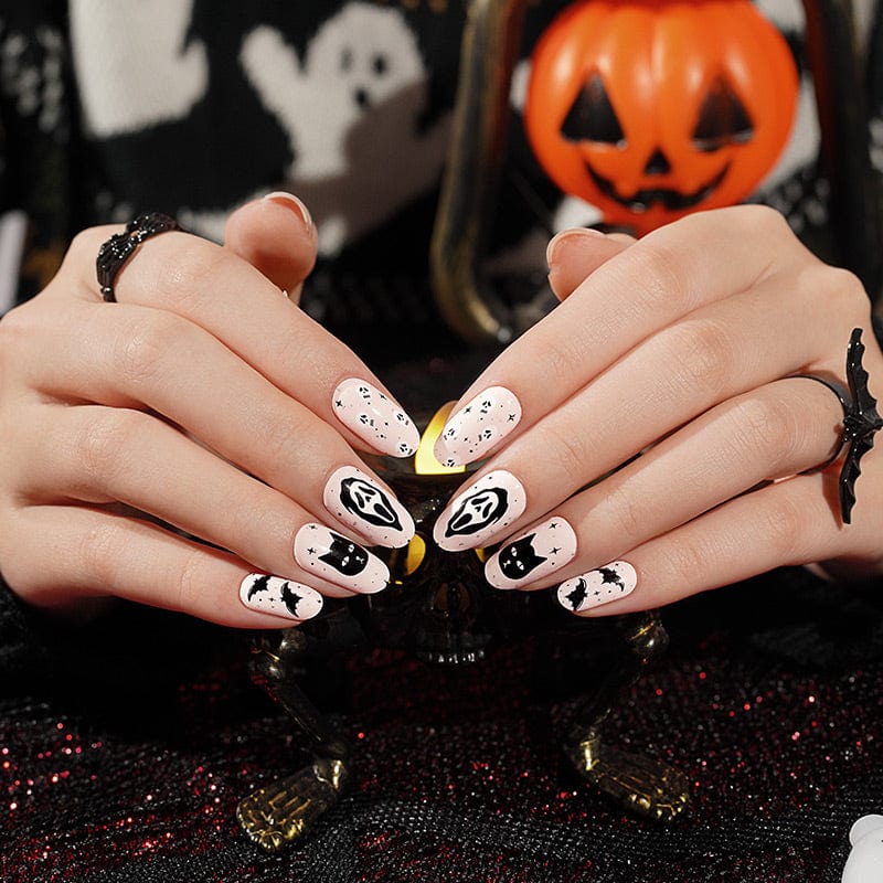 Black and white Halloween nail wraps featuring ghosts and cats with pumpkin decoration