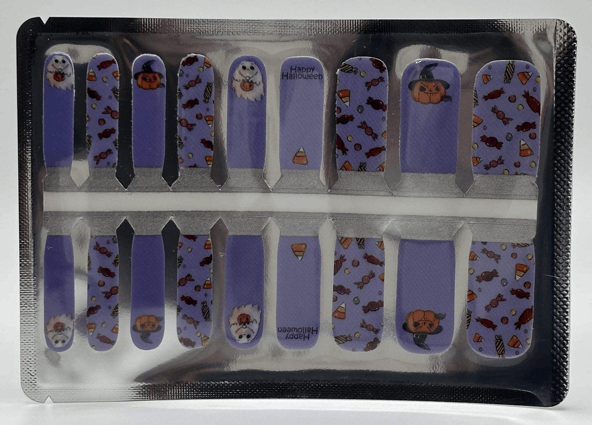 Mini me nail wrap sheet showing purple Halloween designs with ghosts, pumpkins and sweets