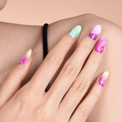 Close up of tropical mandala nail wraps on hand in gradient colours