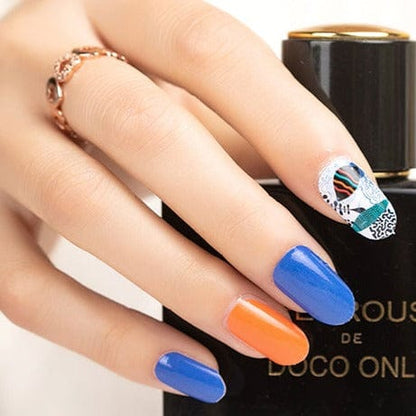 Blue and orange nail wraps with one abstract face art accent nail