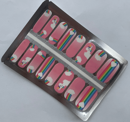 Pink nail wraps with colourful unicorn and rainbow cartoon patterns in packaging
