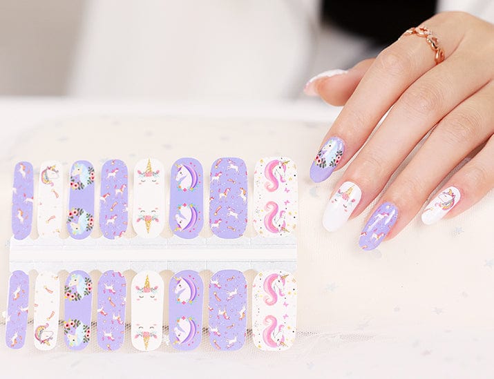 Purple unicorn nail wraps applied on hand with matching sheet showing cute kawaii nail art designs
