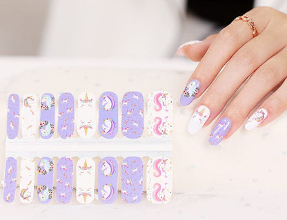 Purple unicorn nail wraps applied on hand with matching sheet showing cute kawaii nail art designs