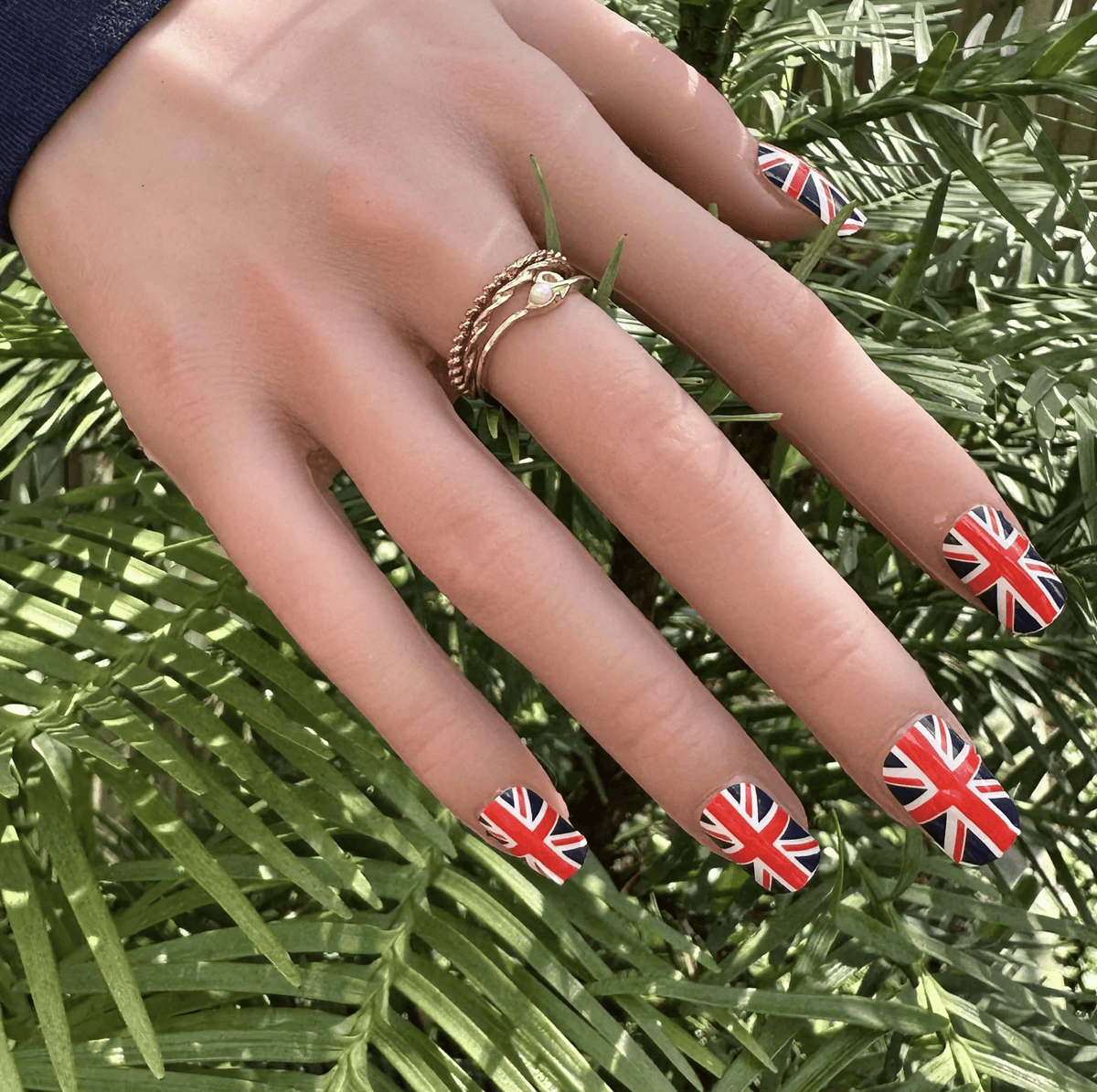 Union Jack nail wraps on hand British flag red white blue patriotic nail art