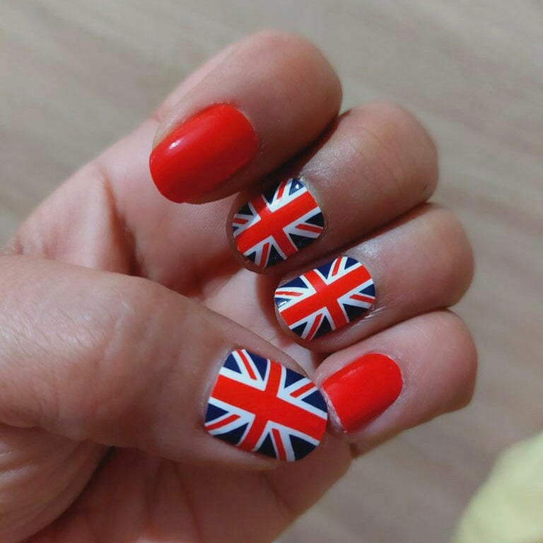 Red glossy nails with Union Jack nail wraps British flag patriotic nail design