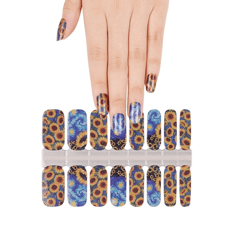 Hand selecting Van Gogh sunflower nail wraps with blue swirls and yellow floral patterns