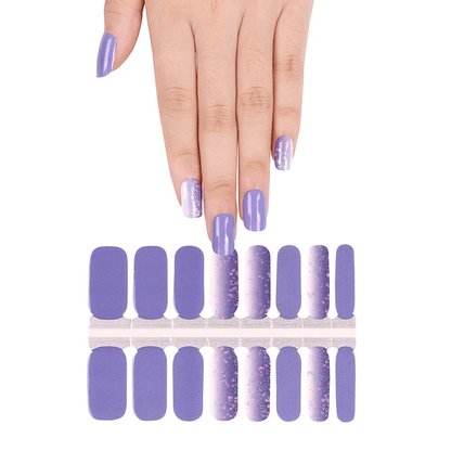 Purple nail wrap sheet with hand displaying violet glitter nail art design