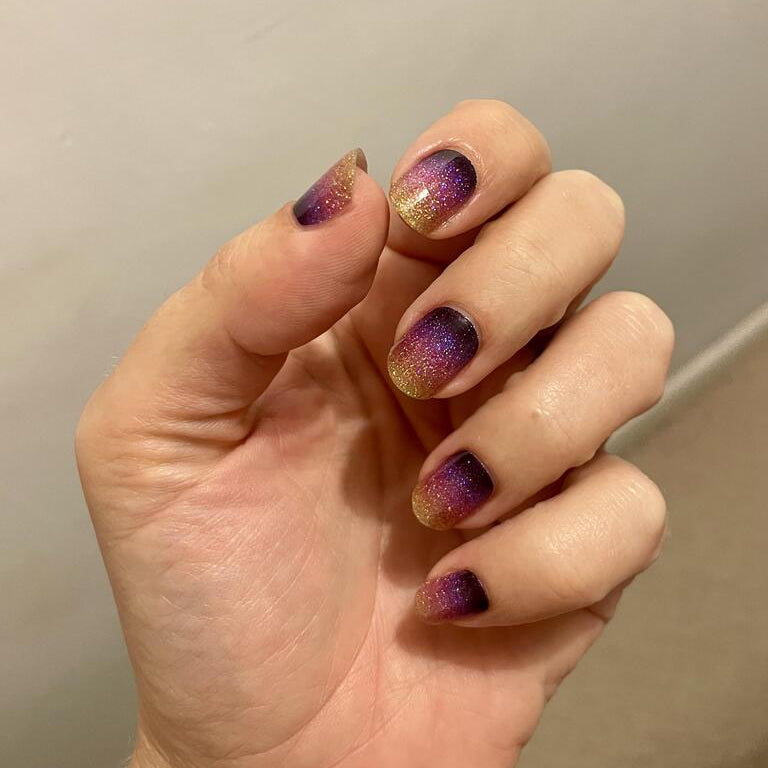 Holy Classics nail wraps with purple-to-gold glitter ombré on short round nails