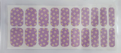Lilac nail wraps with small white and yellow daisy floral pattern