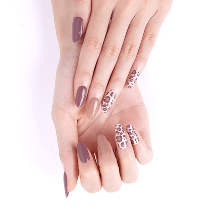 Hands wearing brown leopard print and plum non-UV nail wraps manicure design