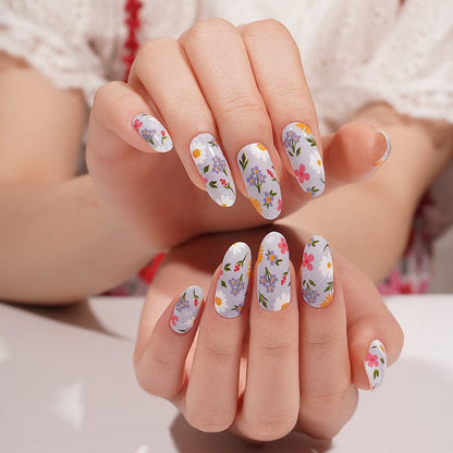 Lilac nail wraps with multicolour wildflower floral print, glossy finish, almond shape