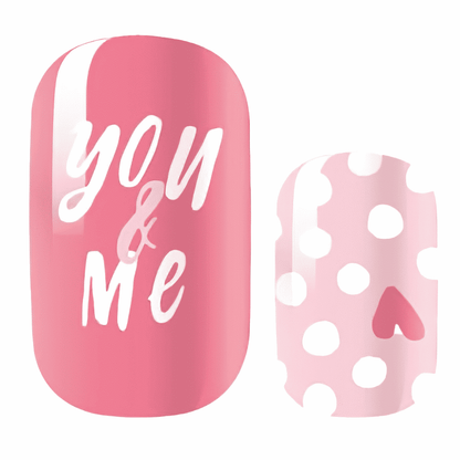 Pink nail wraps with "You & Me" script text and pale pink polka dot heart design