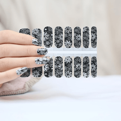 Non-UV nail wraps with black silver firework burst patterns displayed on hands showing complete manicure
