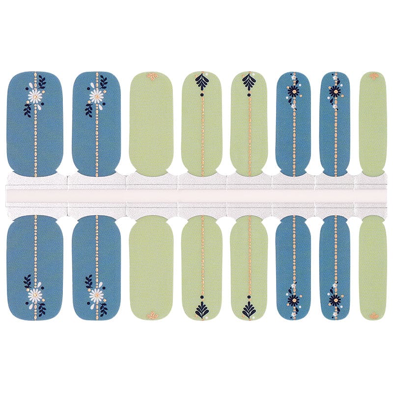 Folk art nail wraps in dusty blue and sage green with daisy and leaf motifs
