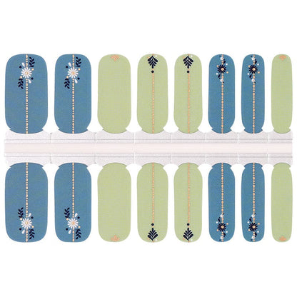 Folk art nail wraps in dusty blue and sage green with daisy and leaf motifs