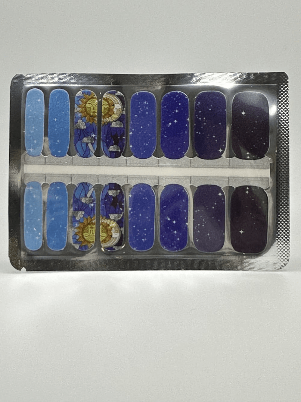 Zodiac themed nail wraps sheet with blue celestial patterns and golden moon designs