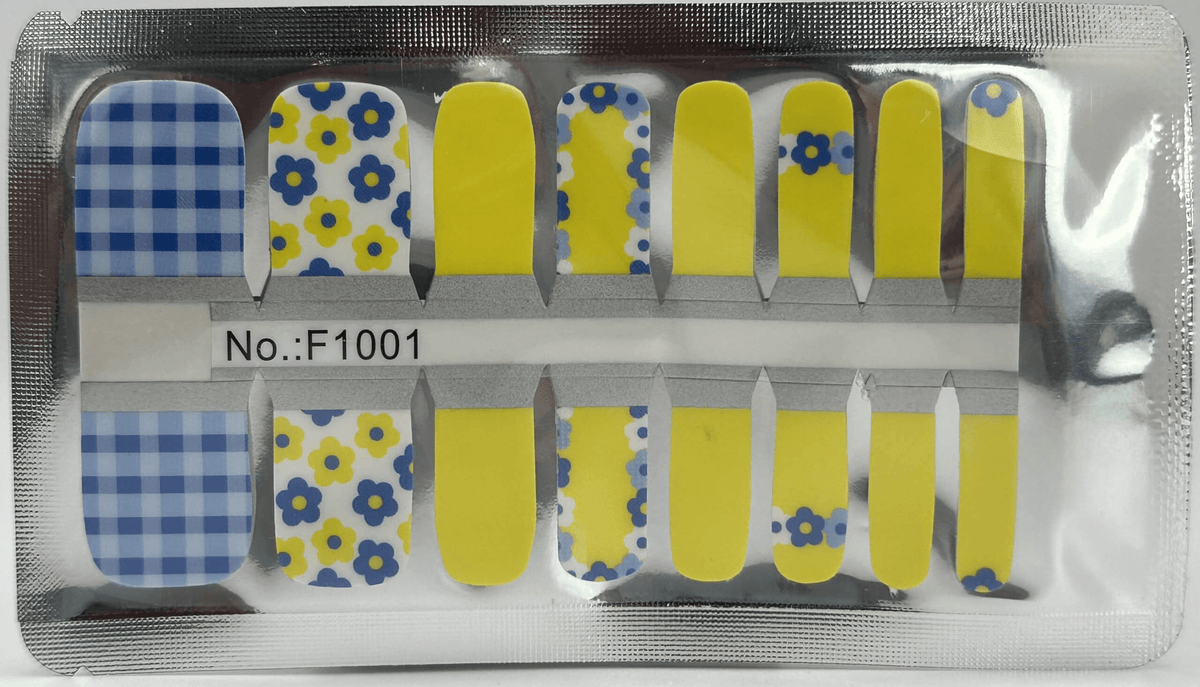 Pedicure nail wraps in packaging showing blue floral and yellow solid colour patterns