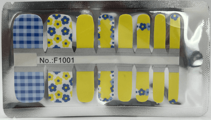 Pedicure nail wraps in packaging showing blue floral and yellow solid colour patterns