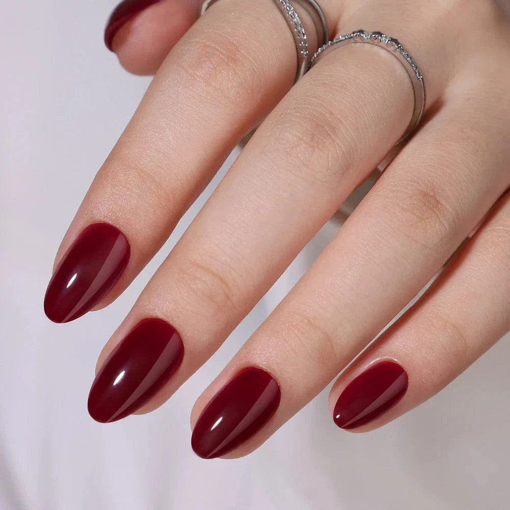 Rich burgundy red glossy short almond gel press-on nails manicure