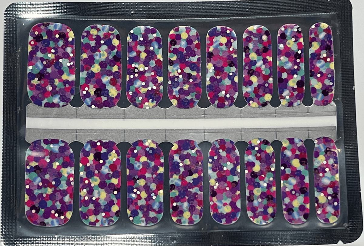 Purple polka dot nail wraps sheet showing colourful multicoloured party pattern for manicure