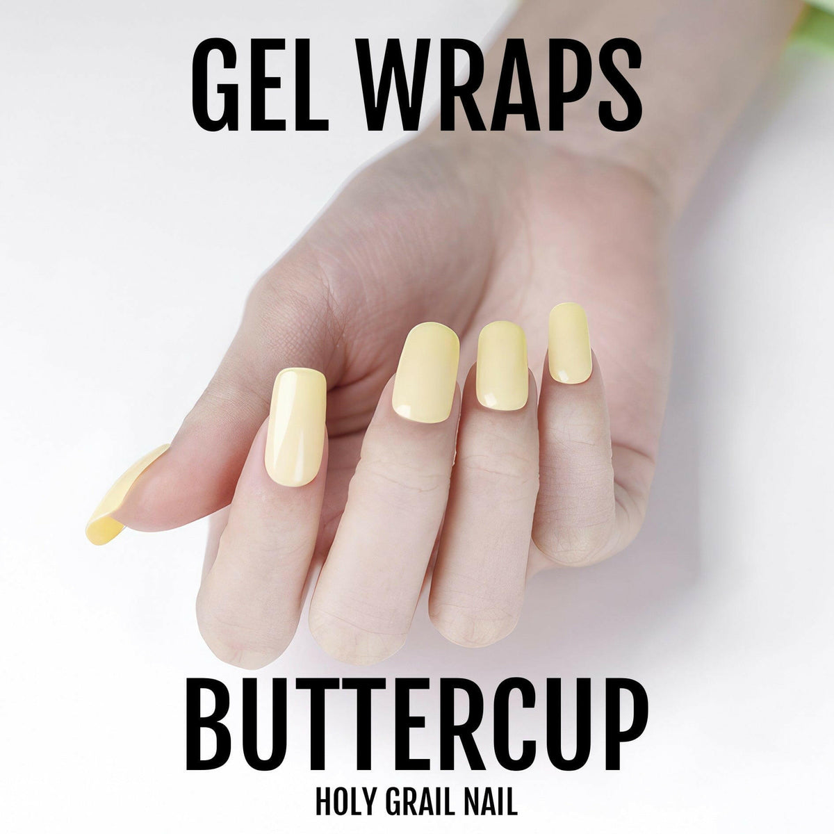 Short yellow gel nail wraps on fingers demonstrating pastel nail art application