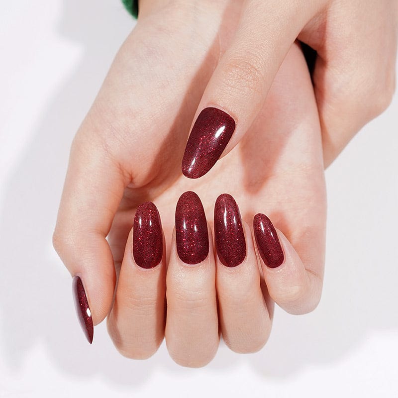 Burgundy sparkly gel nail wraps displayed on both hands with glossy finish