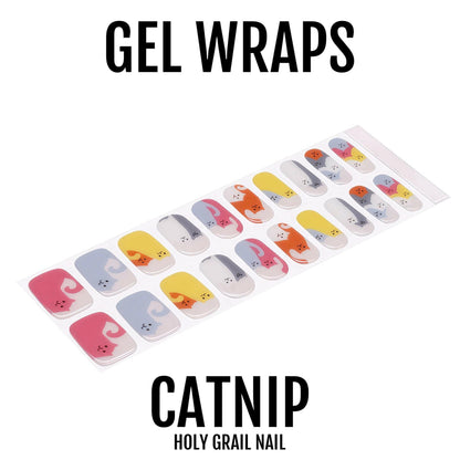 Colourful cat-themed gel nail wraps with multicolour paw prints and feline designs