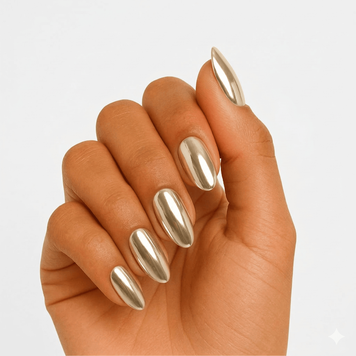 Gold chrome mirror finish gel nails on hand with almond shape manicure