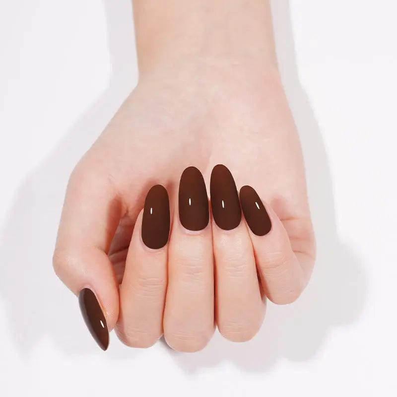 Cupped hands displaying chocolate brown gel nails with glossy finish for at-home manicure